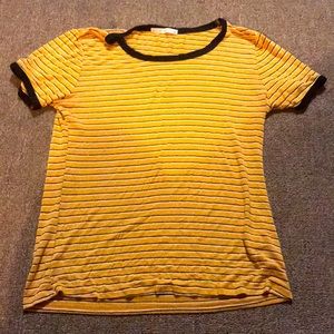 A yellow shirt with black and white stripes